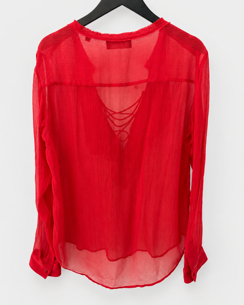 Vista trasera de la blusa roja semitransparente THE KOOPLES