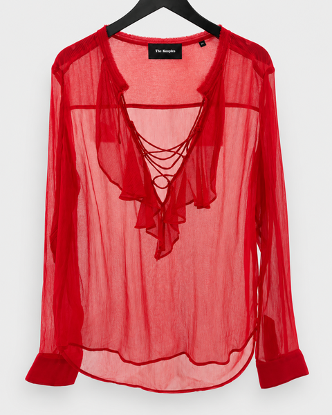 Tejido ligero y transparente de la blusa roja THE KOOPLES
